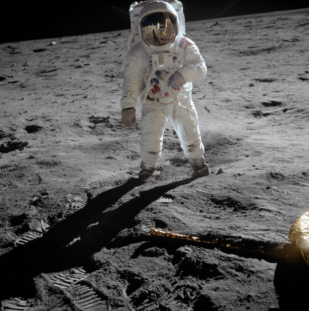 Buzz Aldrin on the Moon as photographed by Neil Armstrong (Armstrong seen in the visor reflection along with Earth, the Lunar Module Eagle, and the U.S. flag)